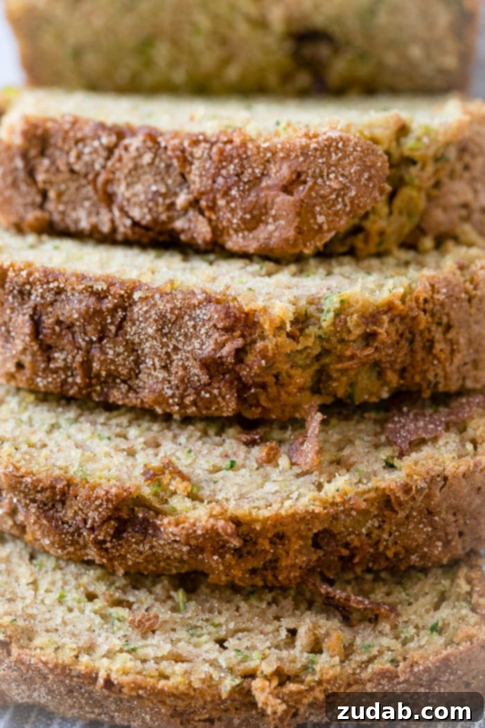 The Ultimate Zucchini Bread 5 A close up of the best zucchini bread recipe with cinnamon sugar topping
