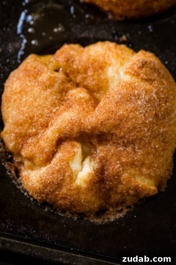 Apple Empty Tomb Rolls 3 Stacked Apple Empty Tomb Rolls, revealing the soft interior and caramel glaze