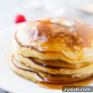 Cloud-Like Sour Cream Pancakes 6 A plate of fluffy banana sour cream pancakes, a truly melt-in-your-mouth breakfast.