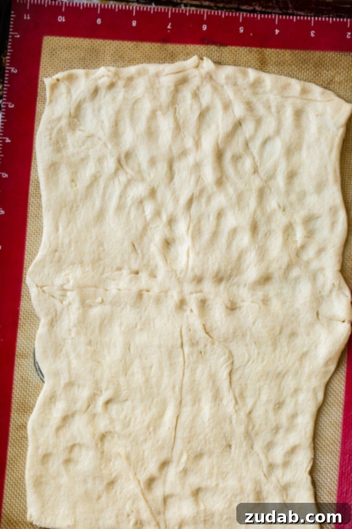 Touchdown Buffalo Chicken Dip 4 a roll of crescent roll dough with seams pinched together