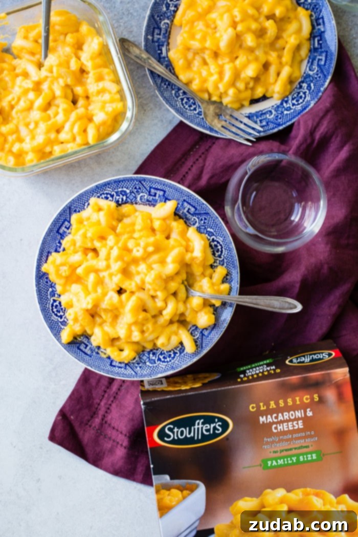 Effortless Garlic Roasted Vegetables 6 A bowl of Stouffer's macaroni and cheese, perfectly paired with a vibrant medley of roasted garlic vegetables, highlighting a balanced and delicious meal.