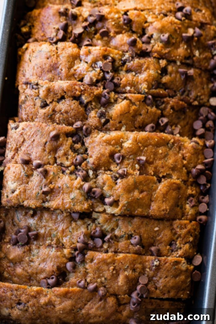 Decadent Chocolate Chip Zucchini Bread 4 an overhead picture of a loaf of sliced chocolate chip zucchini bread still in the bread pan