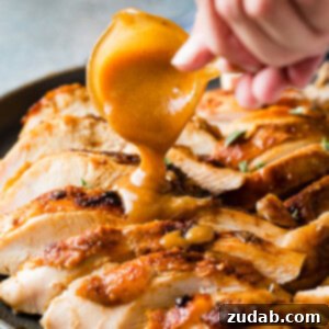 A beautifully cooked apple pecan smoked turkey breast, sliced and ready to serve.