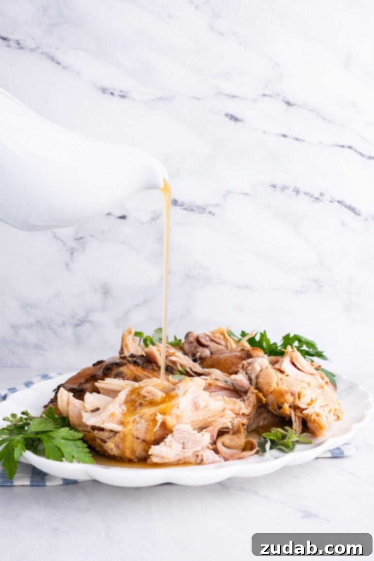 A large, elegant platter generously filled with tender, succulent chunks of turkey meat, promising a delightful and satisfying meal.