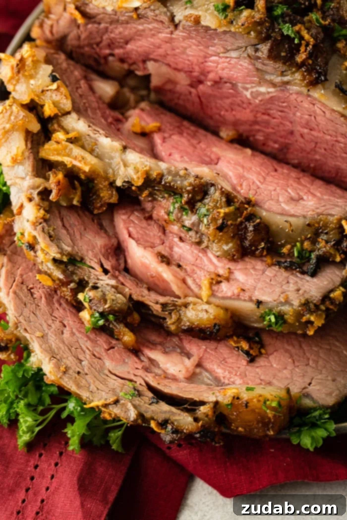 The Ultimate Prime Rib Recipe 3 Close-up of a perfectly cooked prime rib roast, showing the tender interior and crispy exterior