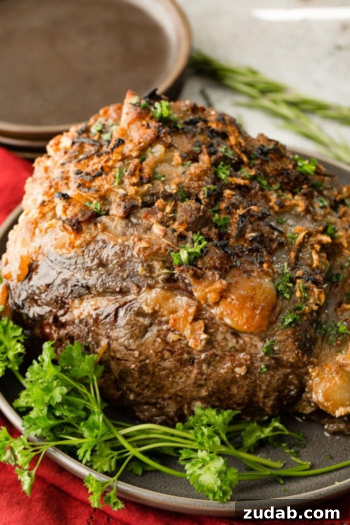 The Ultimate Prime Rib Recipe 4 A festive holiday table setting with a magnificent prime rib roast as the centerpiece