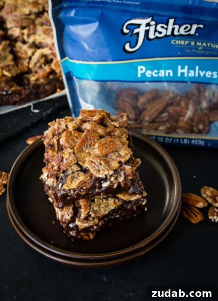 A beautifully presented Pecan Pie Brownie, rich in chocolate and topped with glistening pecans.