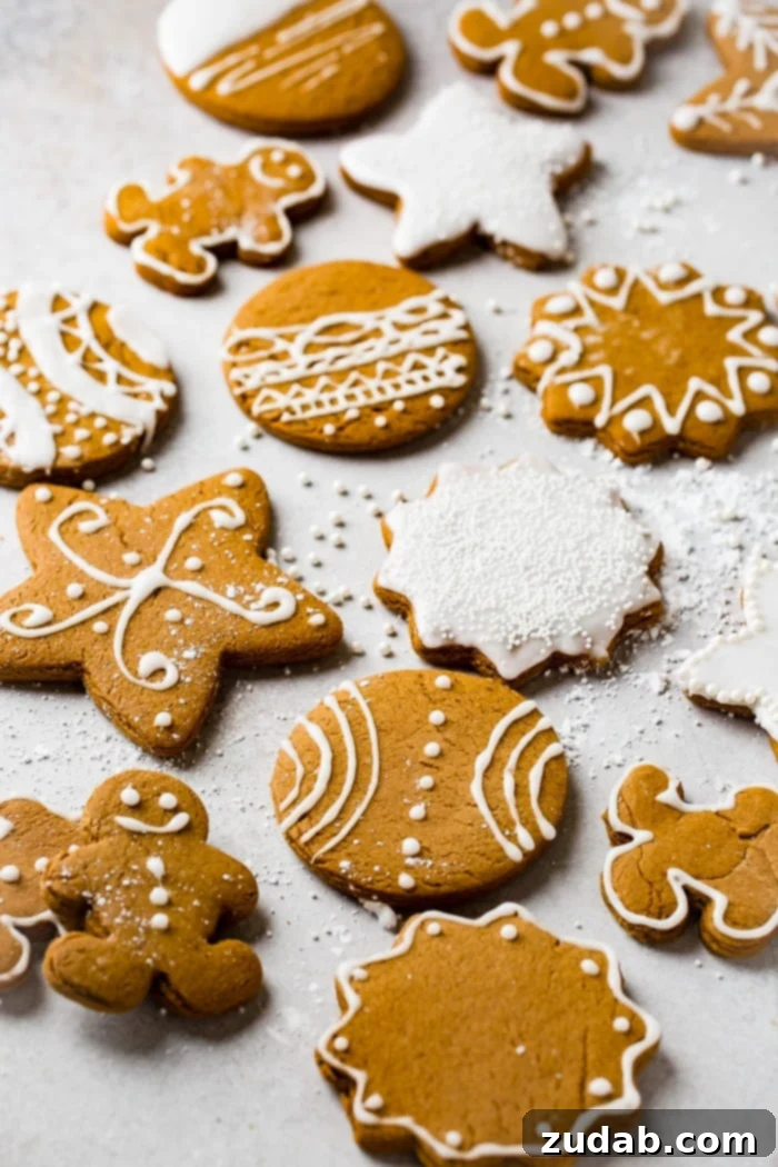 Perfectly Soft Gingerbread Cookies Recipe 4 a grey board with the best soft gingerbread cookies recipe decorated with royal icing.