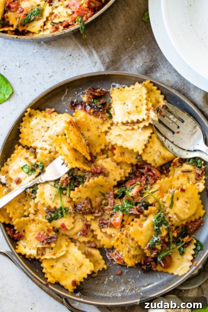 Crispy Pancetta Ravioli: Sun-Kissed Tomato & Spinach Delight 6 A delicious and easy weeknight meal of Crispy Pancetta Ravioli in a skillet, adorned with colorful sun-dried and grape tomatoes, and fresh spinach.