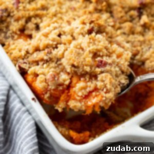 This Sweet Potato Souffle Outshines Ruths Chris 6 A square image of Sweet Potato Souffle with Brown Sugar Topping.
