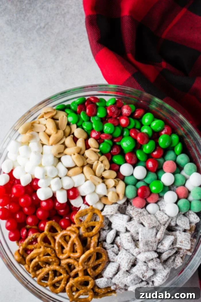 Jolly 5 Minute Christmas Crunch 6 A bowl of 5-Minute Christmas Snack Mix, elegantly presented and ready to serve at a holiday gathering.