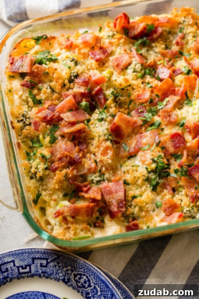 Ultimate Cheesy Bacon Broccoli Bake 2 A beautifully presented creamy cheesy broccoli bake with crispy bacon and panko topping, ready to be served.