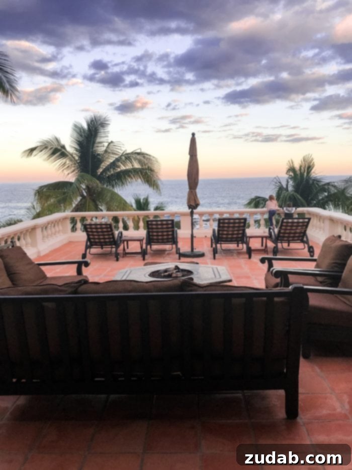 Unlock Mexico's Best Stays 6 A breathtaking sunset over a tranquil beach framed by palm trees in coastal Mexico