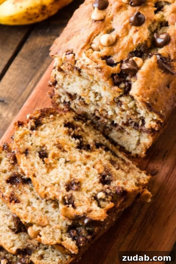 Peanut Butter Swirl Banana Bread 5 Multiple slices of moist peanut butter banana bread arranged next to a full loaf, showcasing its rich texture and delicious appeal.