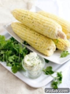 Cilantro Buttered Corn 4 A smaller, vertical shot of cilantro butter corn on a plate, ready to be served.