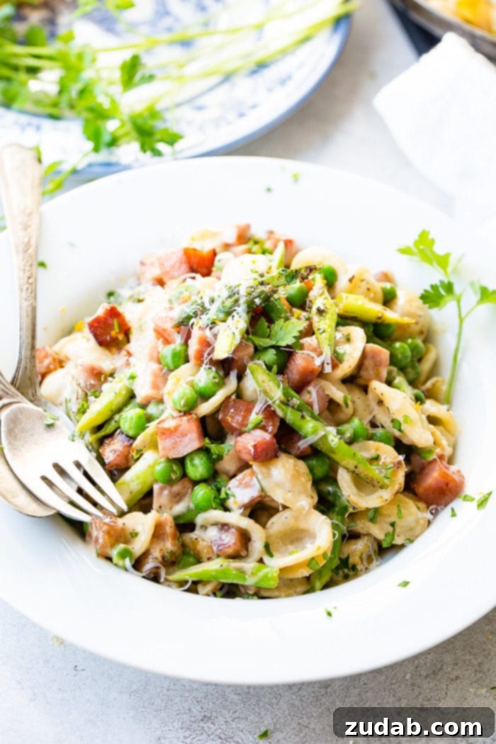 A delicious bowl of Spring Ham and Asparagus Lemon Cream Pasta, perfect for Easter.