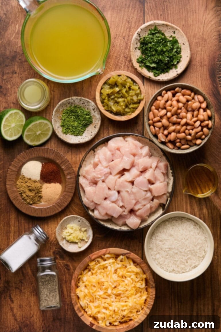 a photo of all the ingredients for cilantro lime chicken burrito bowl in different small bowls and plates