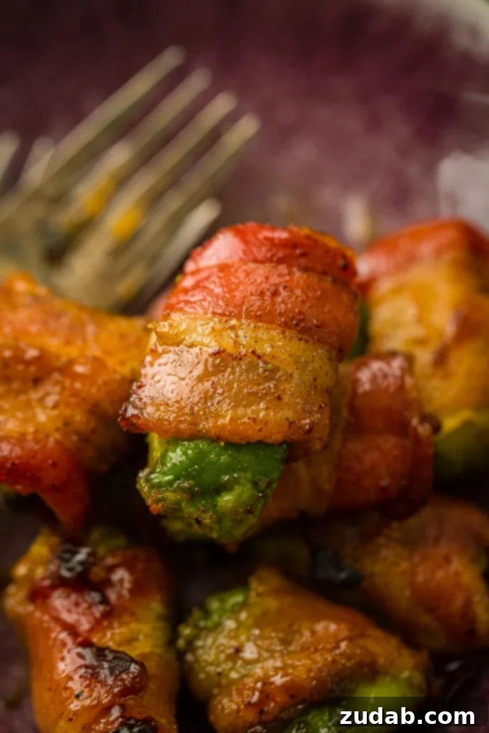 Crispy Bacon Avocado Bites 4 Bacon Wrapped Avocados with a brown sugar coating that have been baked until crispy