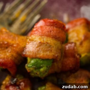 Bacon Wrapped Avocados with a brown sugar coating that have been baked until crispy