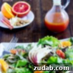 2012's Flavorful Favorites 13 A refreshing Blood Orange Salad, vibrant with colorful citrus segments, greens, and a light dressing.