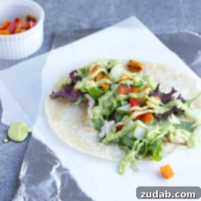 2012's Flavorful Favorites 4 Creamy Avocado Dressing drizzled over a fresh, vibrant salad or wrap filling.