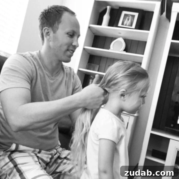 A photo of Cade braiding one of our daughter's hair.