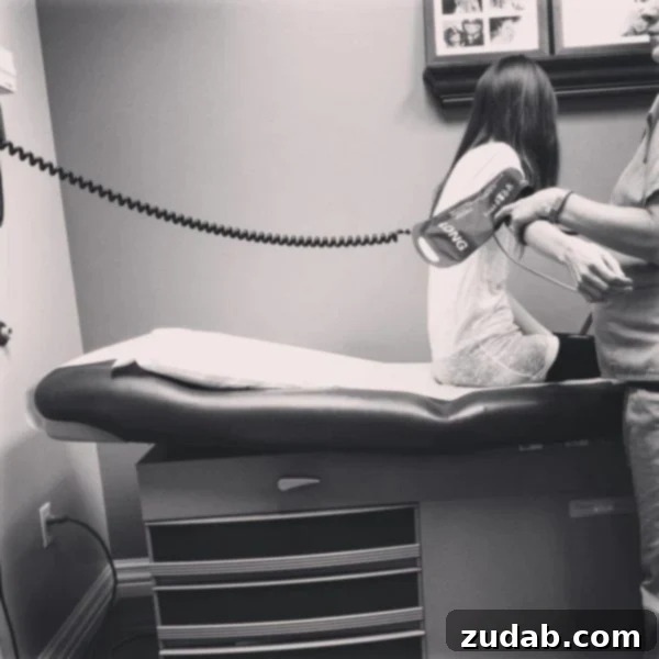 Through the Gloom: Faith's Enduring Struggle Part 19 3 A poignant close-up photo of the author's arm, with a small, child-sized blood pressure cuff tightened around it, highlighting the fragility and vulnerability during medical examination.