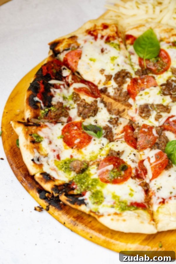 Pesto Pepperoni Grilled Pizza - Oh Sweet Basil A photo of a pesto pepperoni grilled pizza.