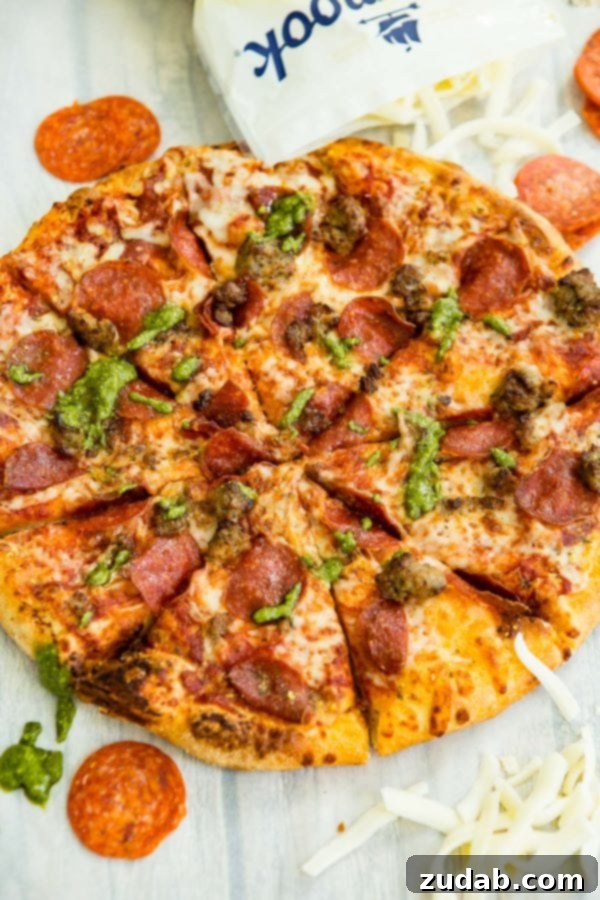 Grilled Pesto Pizza with Pepperoni and Sausage 3 A photo of a pesto pepperoni grilled pizza.