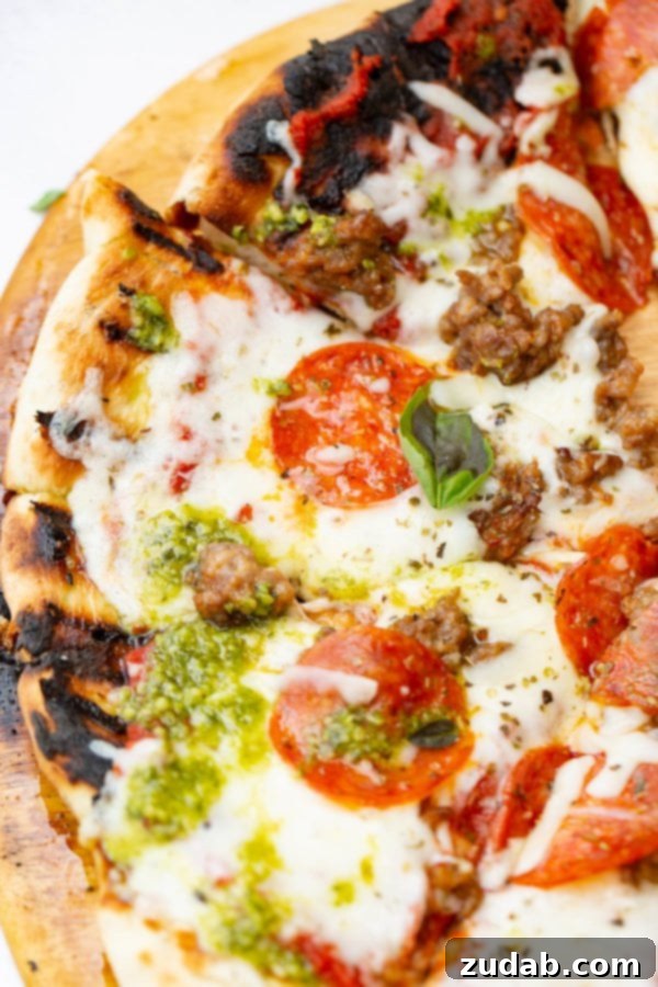 Pesto Pepperoni Grilled Pizza - Oh Sweet Basil A photo of a pesto pepperoni grilled pizza.