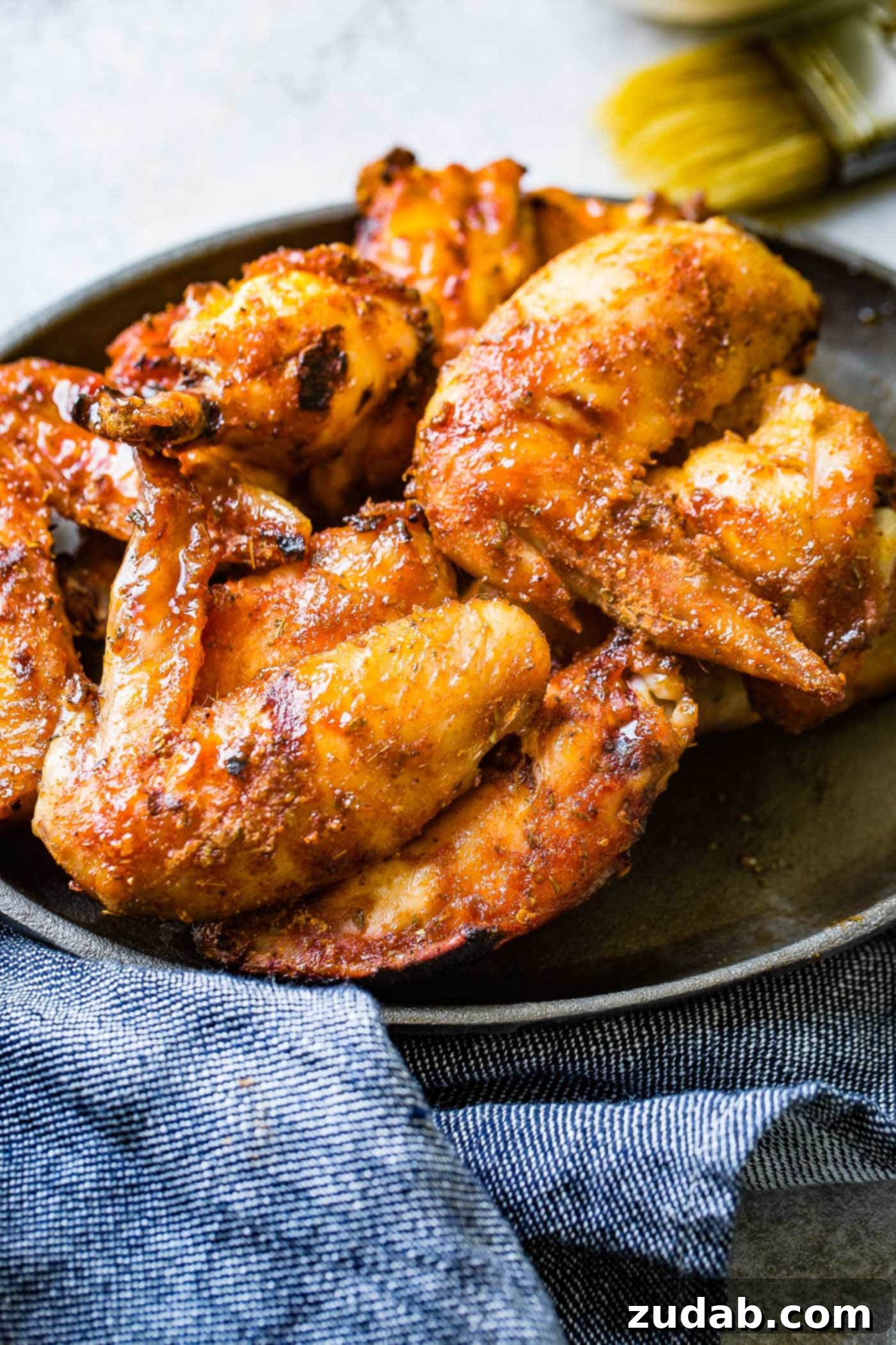 The BEST Dry Rubbed Smoked Chicken Wings A photo of a plate full of dry rubbed smoked chicken wings, ready to be enjoyed.