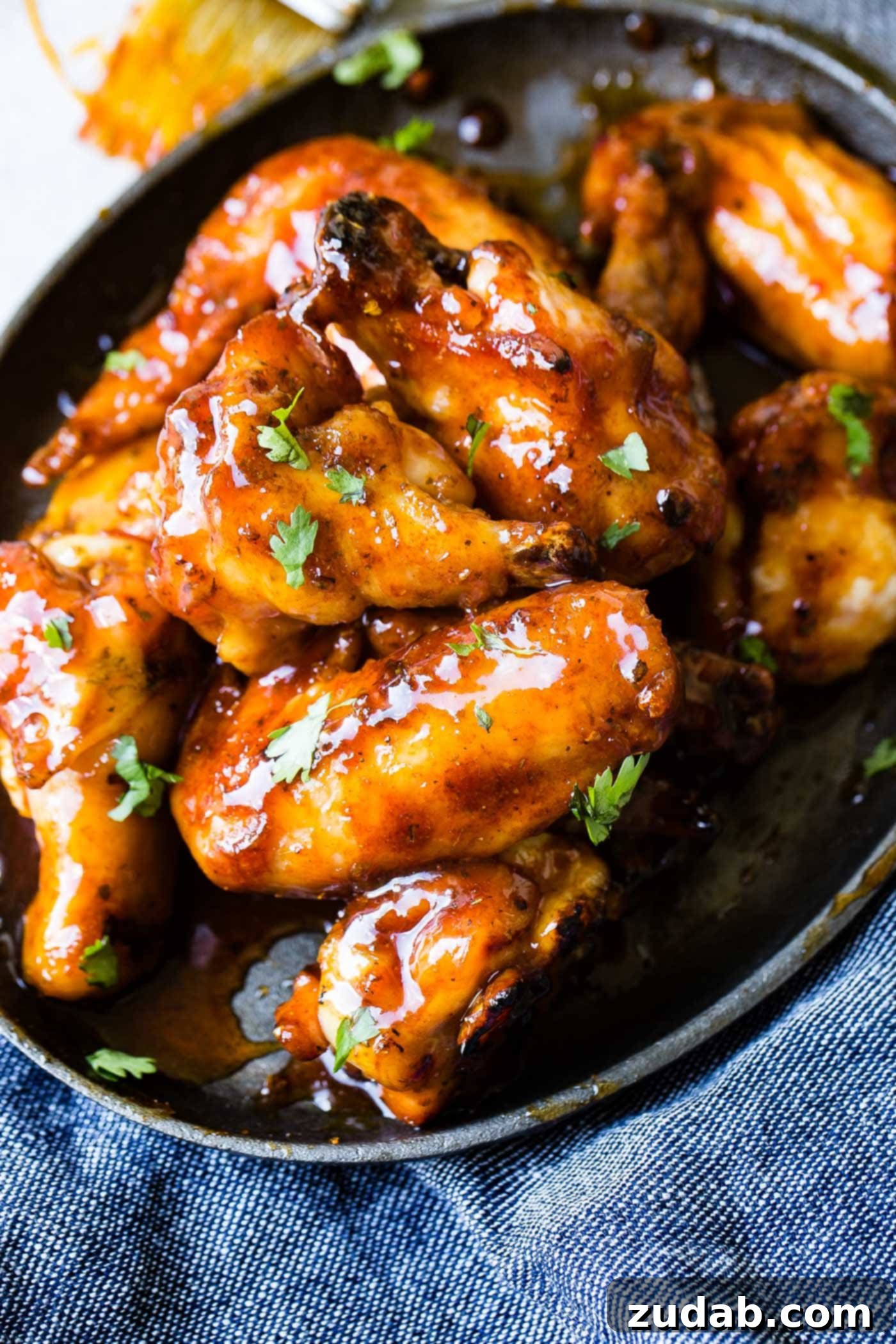 Glazed Smoked Chicken Wings A photo of a plate full of glazed smoked chicken wings.