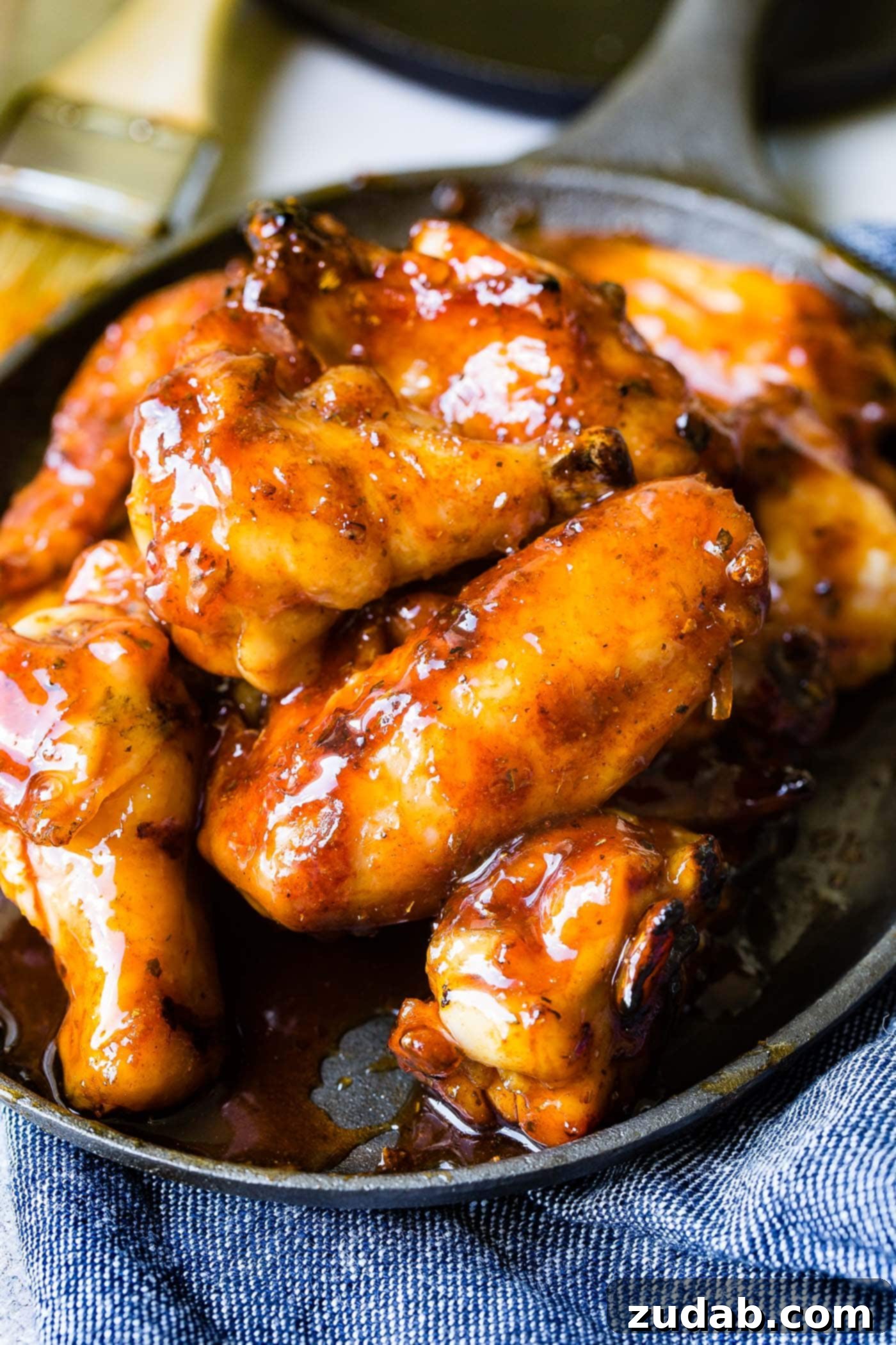 Glazed Smoked Chicken Wings A photo of a plate full of glazed smoked chicken wings.
