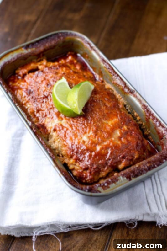 Enchilada Meatloaf with Pepperjack Cheese Sliced Turkey Enchilada Meatloaf revealing cheesy, flavorful interior.