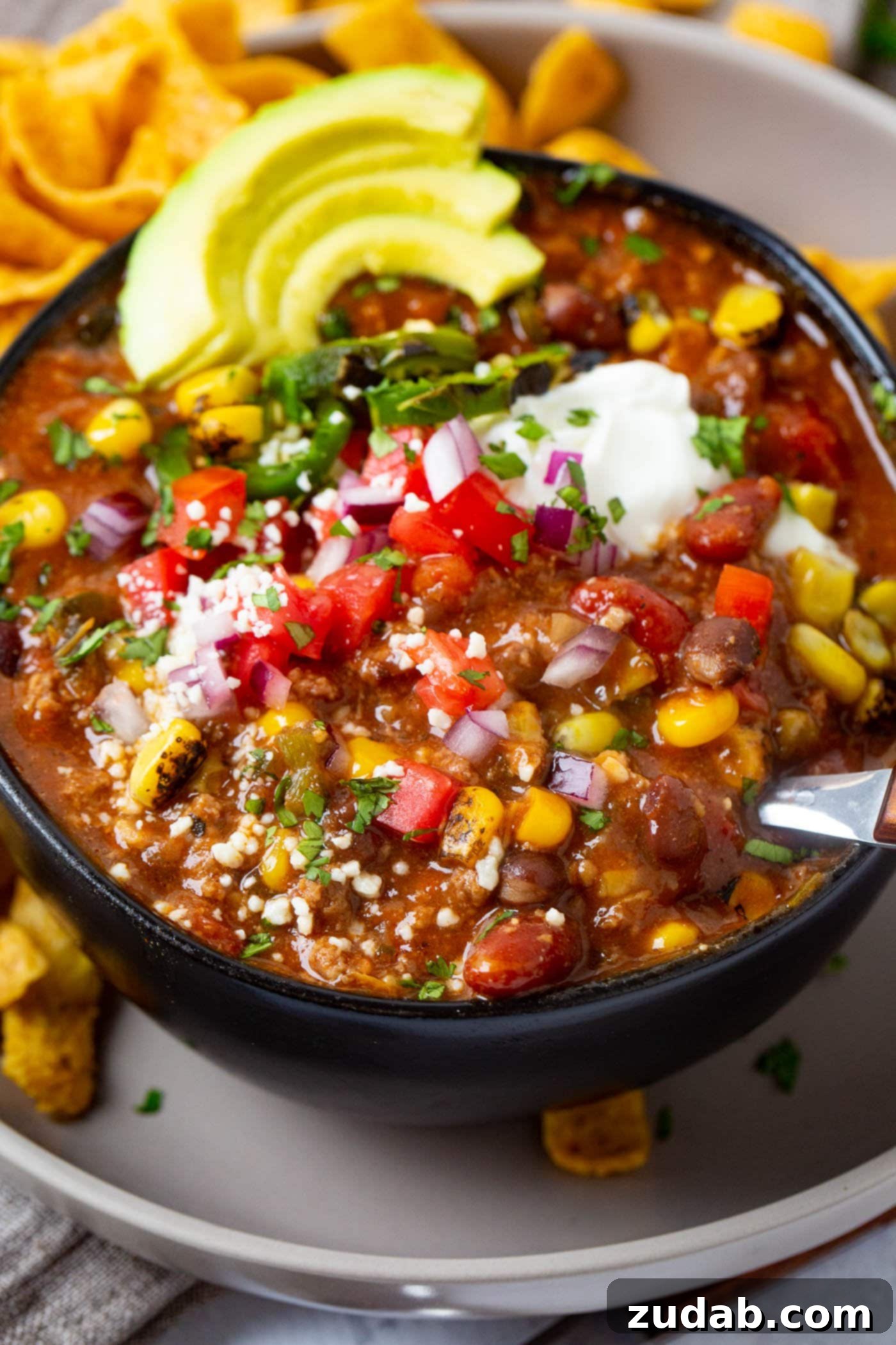 Easy Instant Pot Taco Ground Beef Chili 4 Close-up shot of the savory Taco Ground Beef Instant Pot Chili, ready to be enjoyed with a spoon.