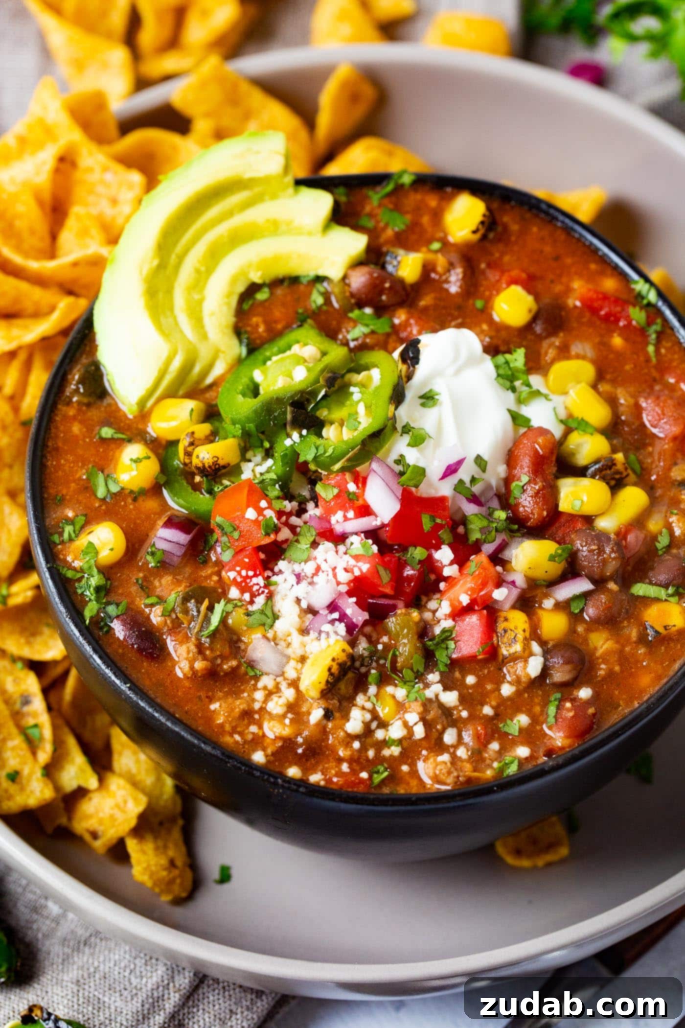 Easy Instant Pot Taco Ground Beef Chili 5 Overhead shot of the comforting Taco Ground Beef Instant Pot Chili, generously topped with fresh ingredients.