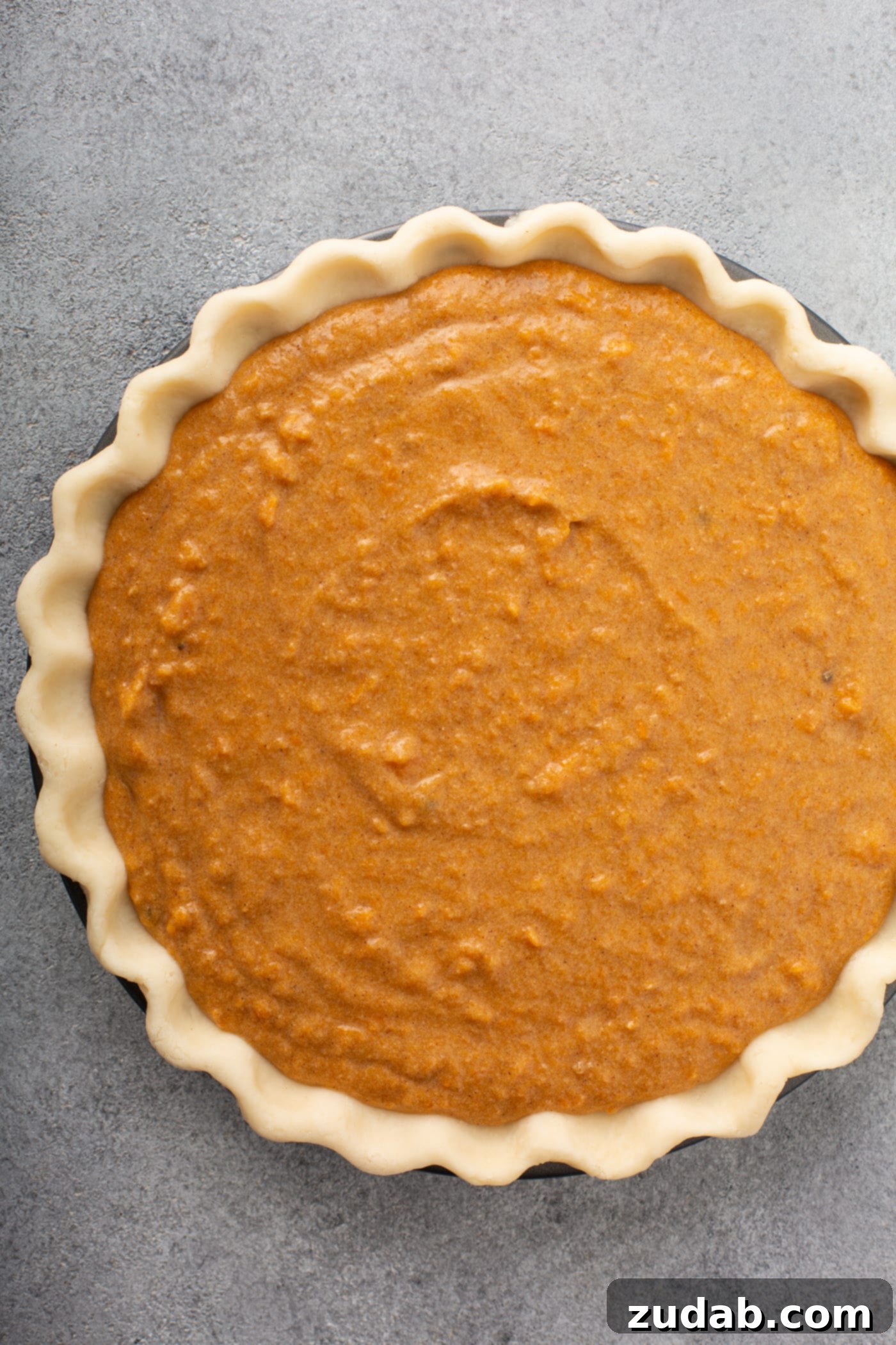 Perfectly Southern Sweet Potato Pie A photo of an unbaked sweet potato pie.