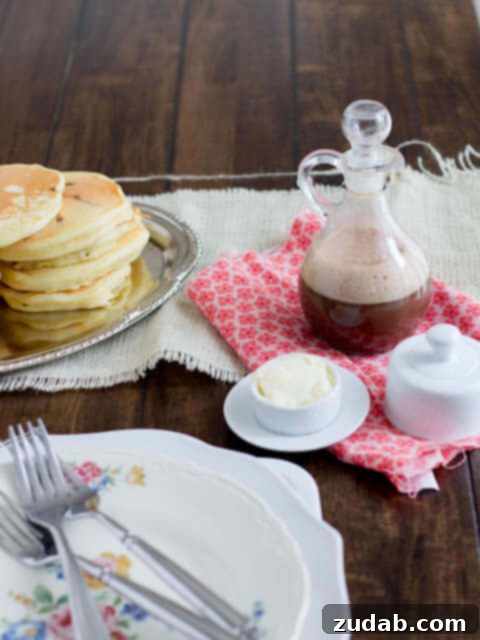 Rich and creamy chocolate syrup drizzled over pancakes