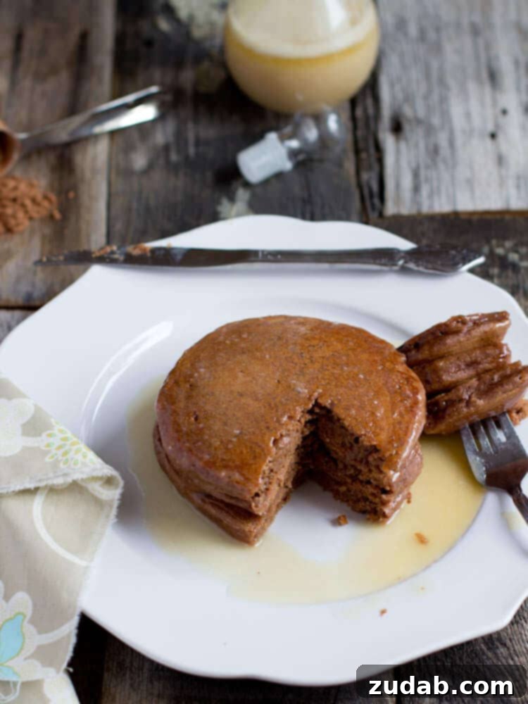 Fluffy healthy chocolate pancakes served with fresh berries