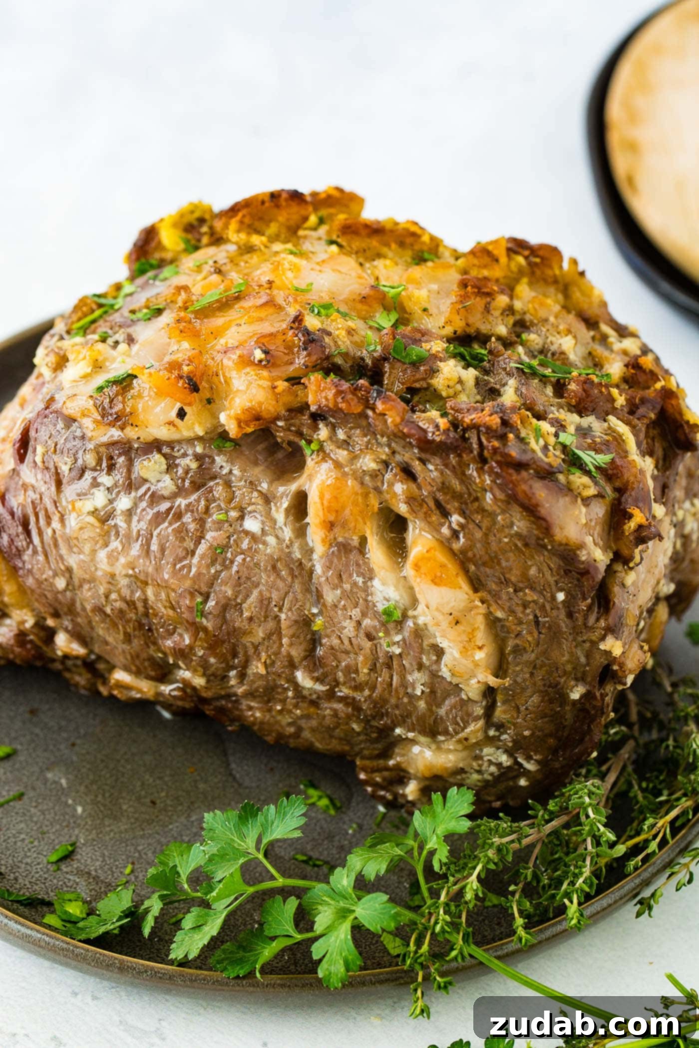 Instant Pot Prime Rib A close-up of a perfectly cooked Instant Pot Prime Rib roast, boasting a savory, golden-brown crust.