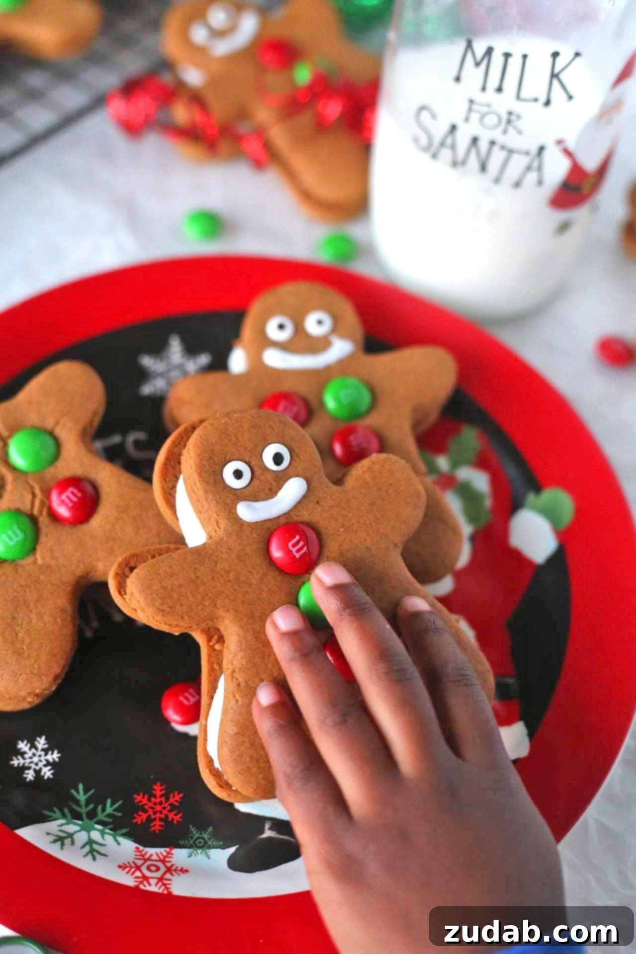 Gingerbread Men Creme Delights 3 A close-up shot of a perfectly baked Gingerbread Man Sandwich Cookie, featuring its soft texture and the rich creamy filling peeking out, ready for decoration or enjoyment.