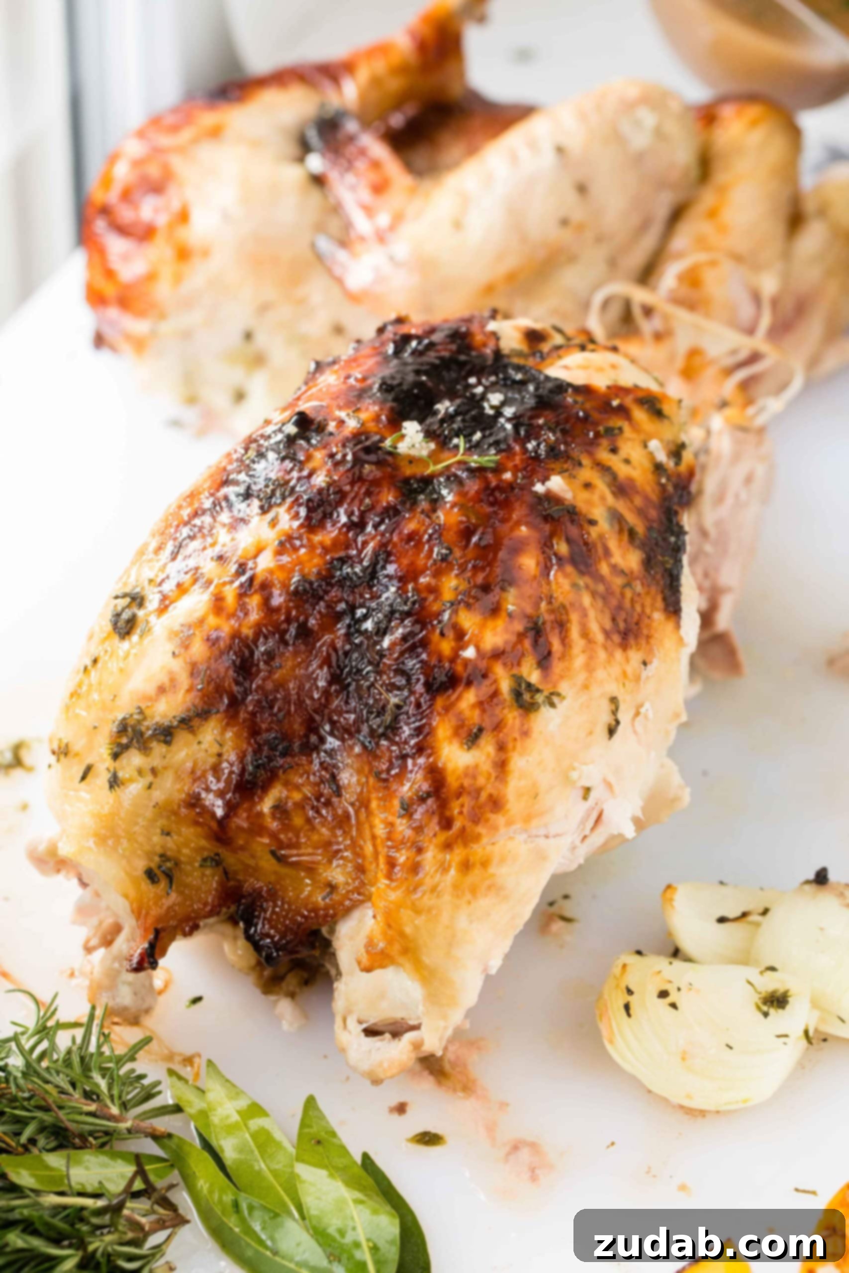 How to Carve a Turkey A photo of a whole roasted turkey carcass after the legs, thighs, and wings have been expertly carved off.