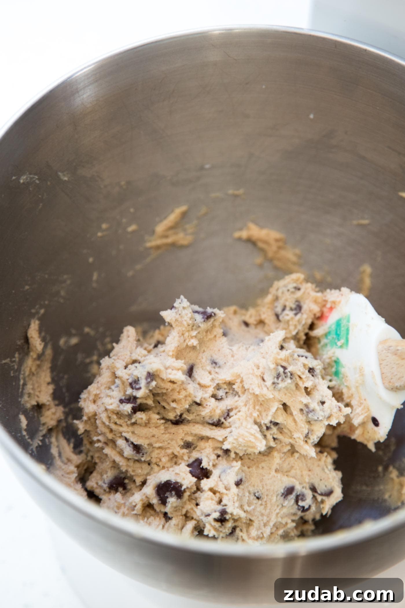Ultimate Chocolate Chip Snickerdoodles 3 Chocolate chip snickerdoodle cookie dough in a mixing bowl