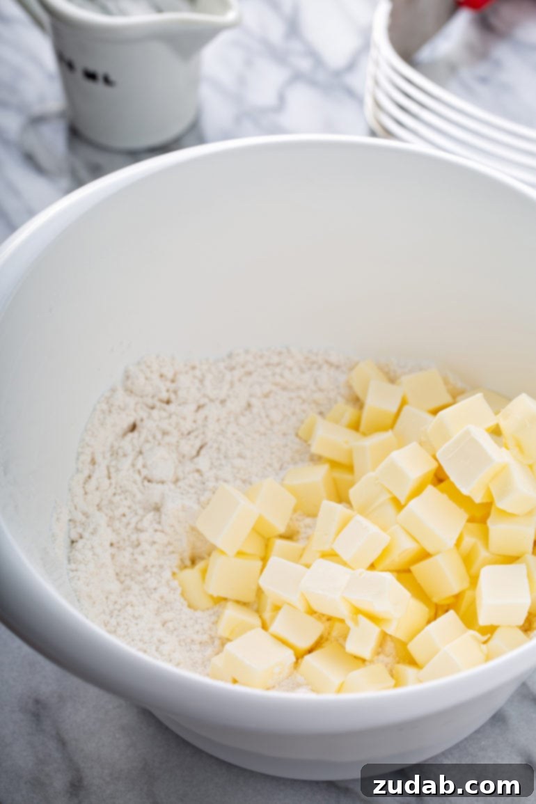 Master My Absolute Favorite Pie Crust With This Video 2 A bowl containing flour and little cubes of butter.