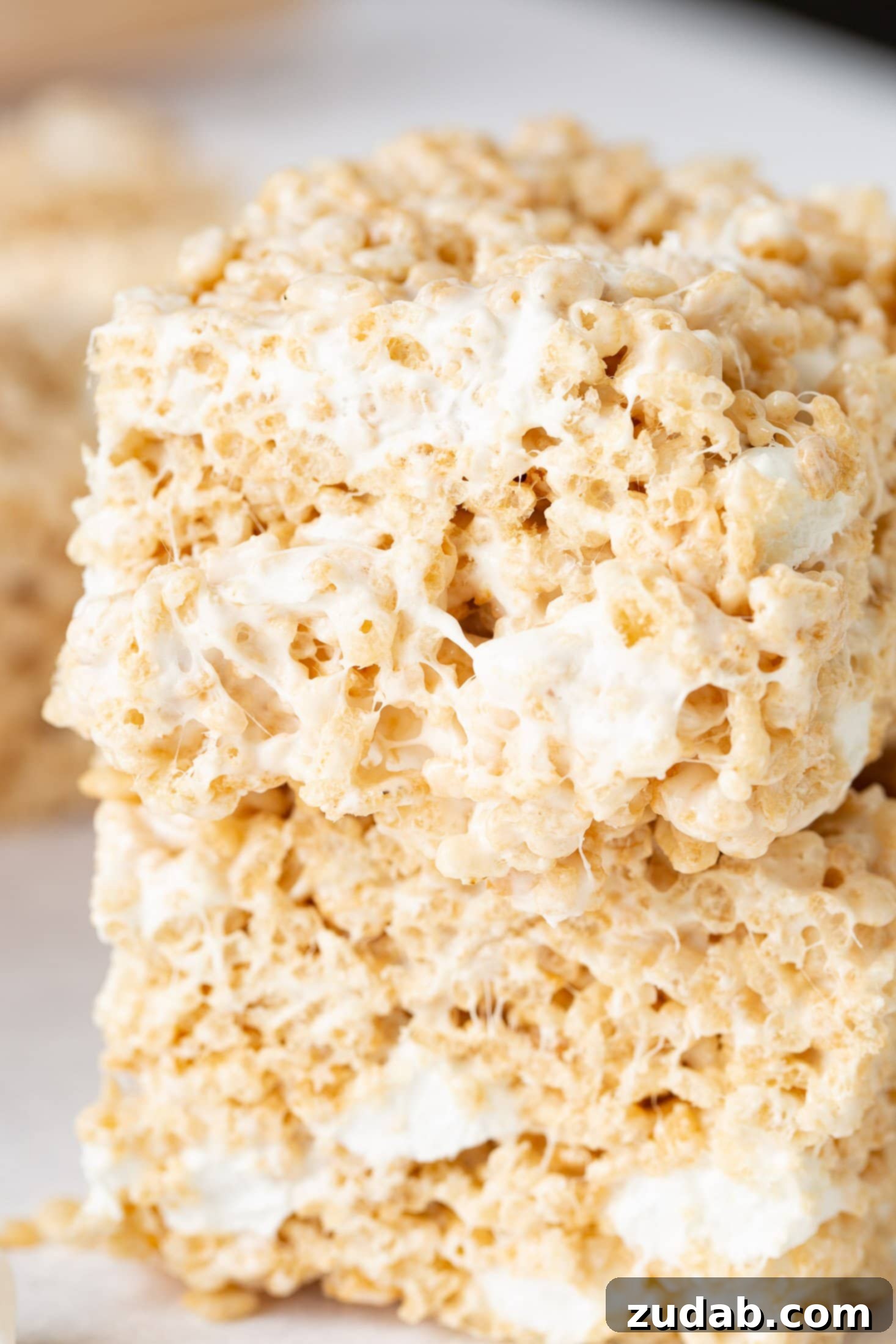 Chewy Gooey Rice Krispie Dreams 2 Two pieces of rice krispie treats stacked on top of each other.