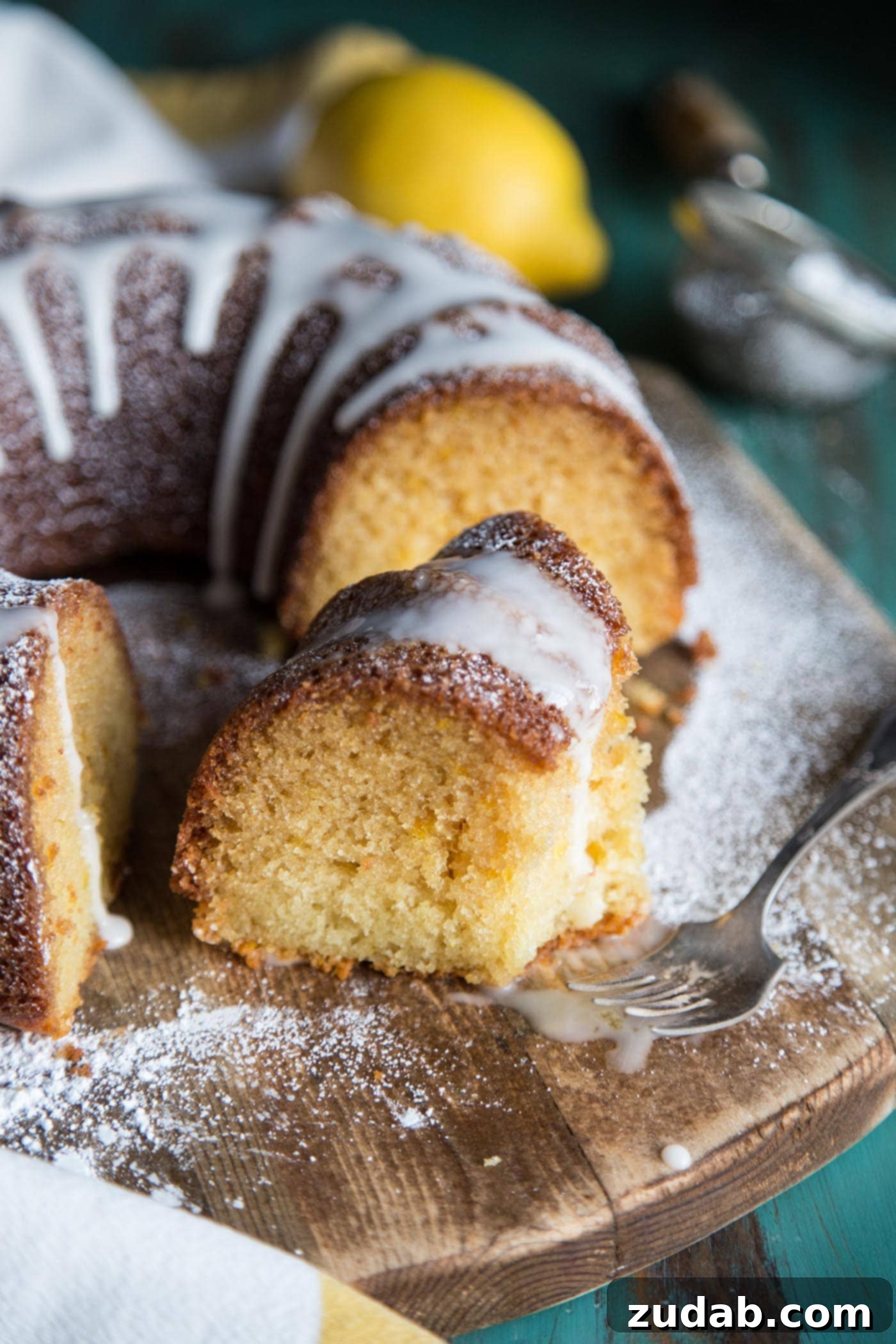 Zesty Lemon Crown 2 A slice of lemon bundt cake with glaze