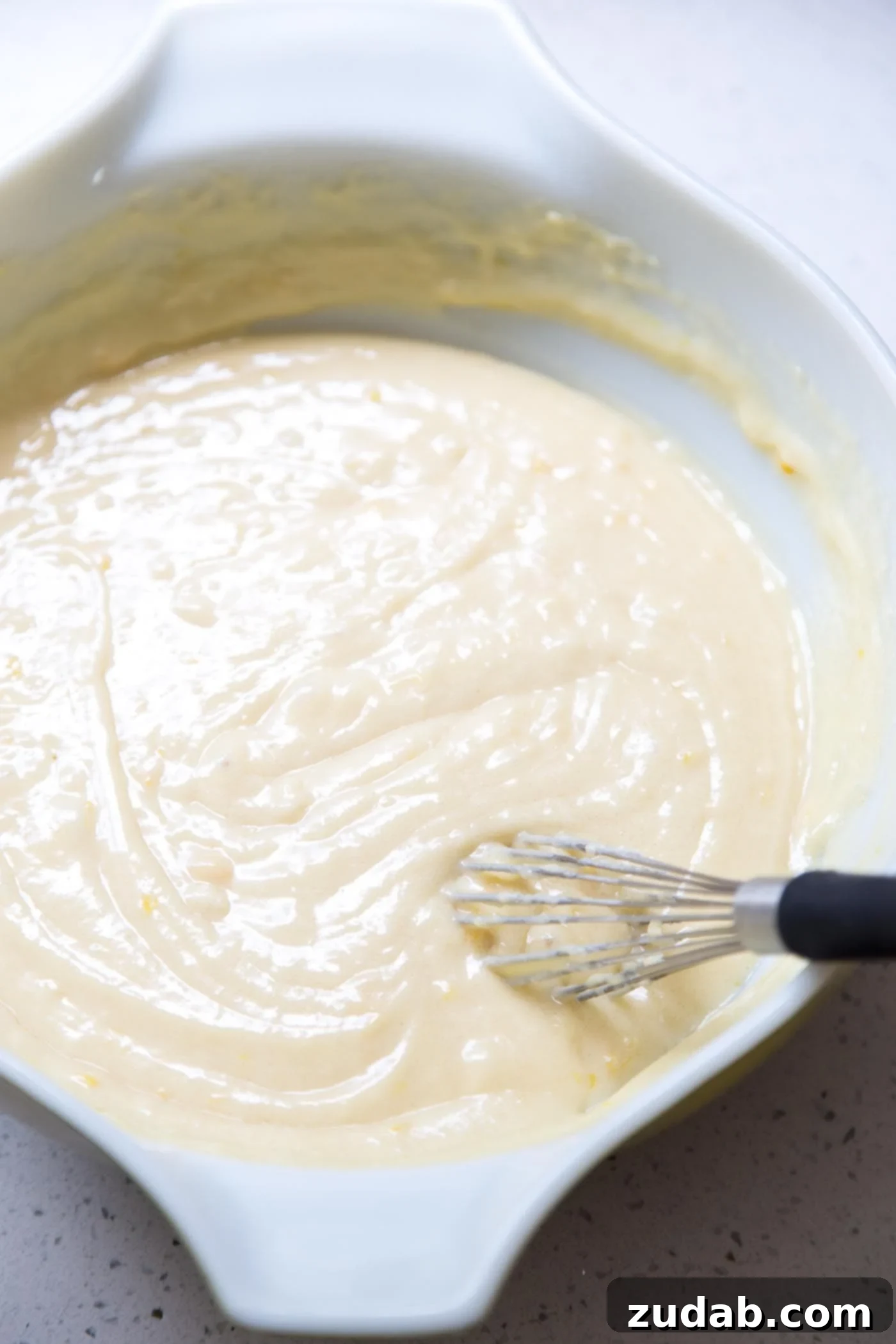 Zesty Lemon Crown 3 Lemon bundt cake batter in a mixing bowl