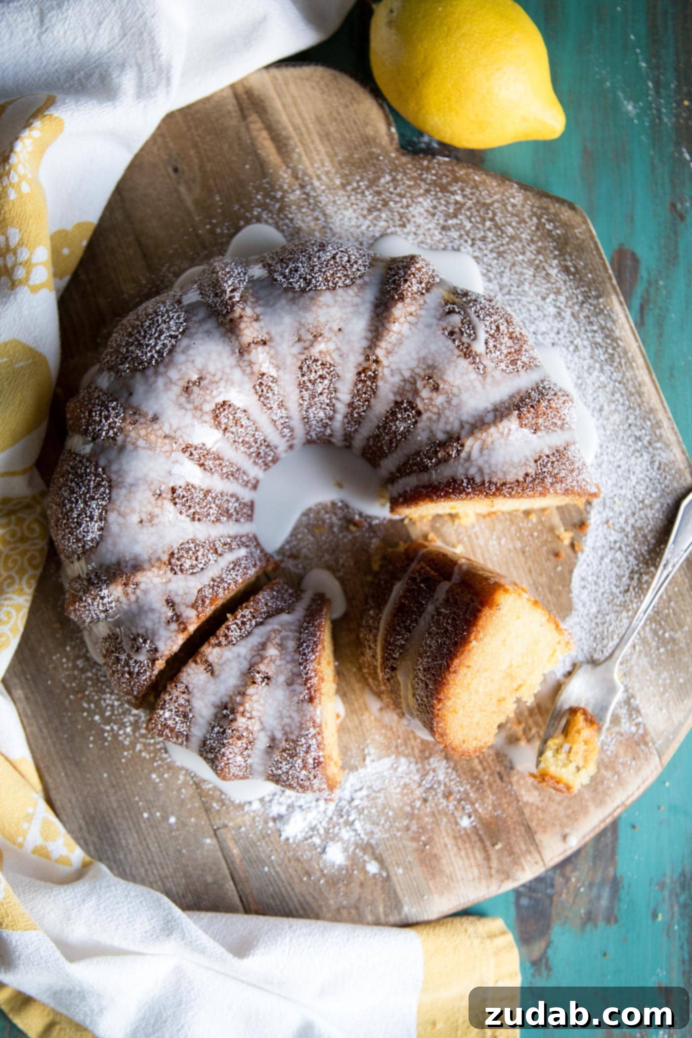 Zesty Lemon Crown 6 Lemon bundt cake with glaze on a wooden board