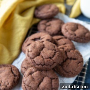 Chocolate snickerdoodle cookies on a metal grate