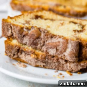 A beautifully baked loaf of Snickerdoodle Bread with a perfect golden crust.